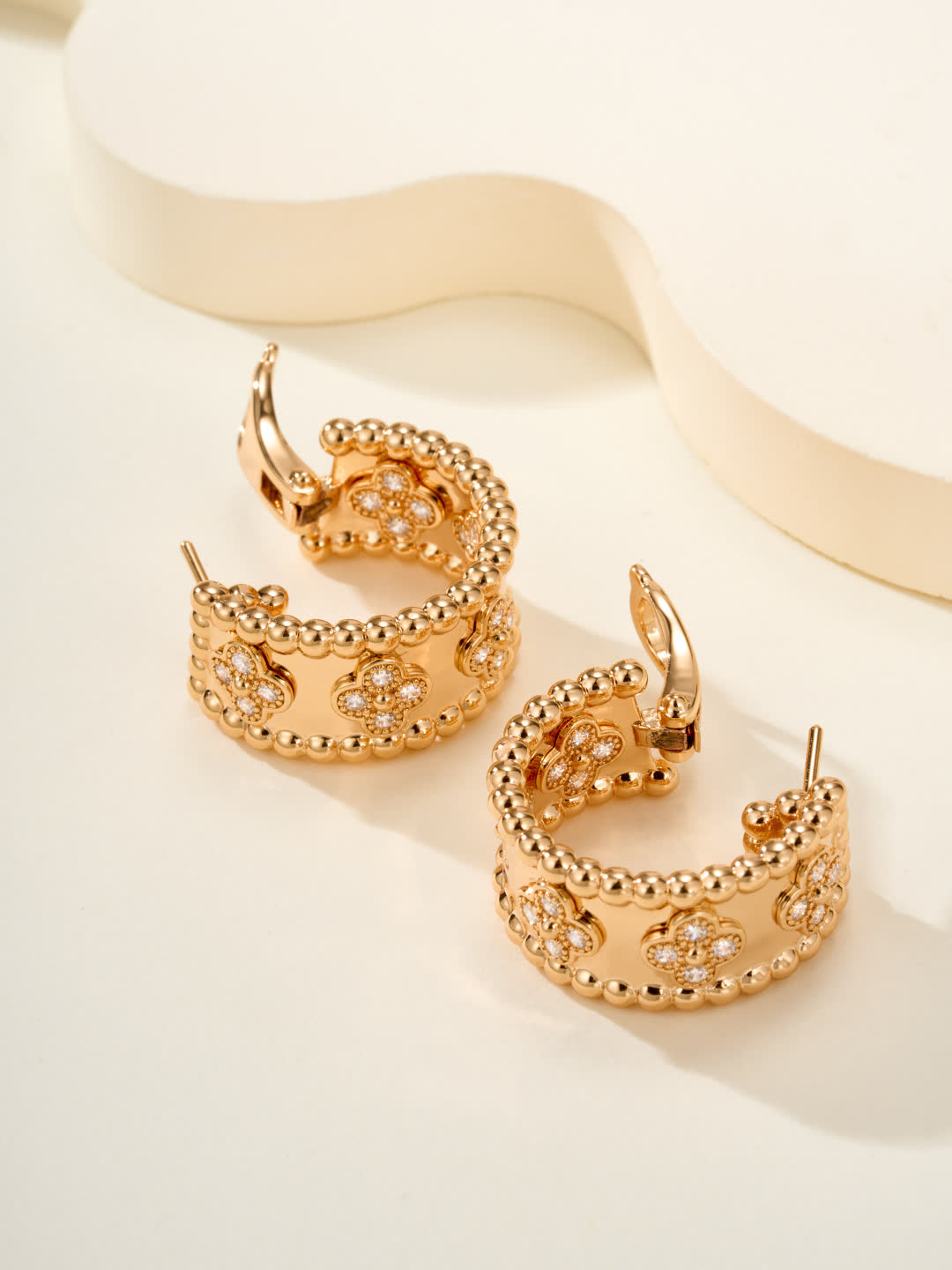 Van Cleef & Arpels Elegant Gold and Silver Hoop Earrings with Diamond Accents